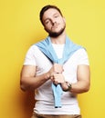 young man in smart casual wear looking at camera over yellow bac Royalty Free Stock Photo