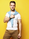 young man in smart casual wear looking at camera over yellow bac Royalty Free Stock Photo