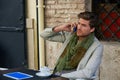 Young man with smartphone in an cafe outdoor Royalty Free Stock Photo