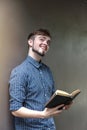 Young man smile and reading the bible book Royalty Free Stock Photo