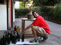 Young man smiling while bottling the wine at home Royalty Free Stock Photo