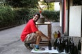 Young man smiling while bottling the wine at home Royalty Free Stock Photo