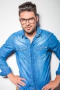 Young man smiling at the camera while wearing glasses Royalty Free Stock Photo