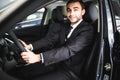 Young man smiling while driving in his car Royalty Free Stock Photo
