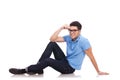 Young man smiling on the floor Royalty Free Stock Photo