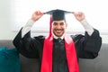 Young man smiling and getting ready for his graduation Royalty Free Stock Photo