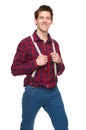 Young man smiling and holding suspenders Royalty Free Stock Photo