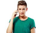 Young man smiling with mobile Royalty Free Stock Photo