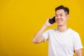Young man smiling positive talking on cellphone Royalty Free Stock Photo