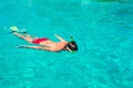 Young man snorkeling in clear tropical turquoise Royalty Free Stock Photo