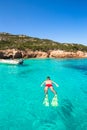 Young man snorkeling in clear tropical turquoise Royalty Free Stock Photo