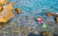 Young man snorkeling in clear tropical turquoise Royalty Free Stock Photo