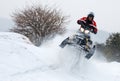 Young man on snowmobile jumping Royalty Free Stock Photo