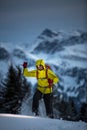 Young man snowshoeing in high mountains,