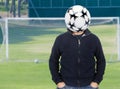 Young man with a soccer ball instead of the head Royalty Free Stock Photo