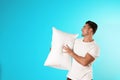 Young man with soft pillow Royalty Free Stock Photo