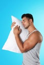 Young man with soft pillow Royalty Free Stock Photo