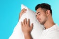 Young man with soft pillow Royalty Free Stock Photo