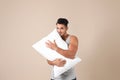 Young man with soft pillow Royalty Free Stock Photo