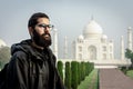 Young man in solo travel lifestyle having holiday in Taj Mahal, India