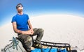 Young man solo traveler taking relax break at Salar de Uyuni Bolivia