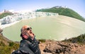 Young man solo traveler taking selfie at Perito Moreno glaciar