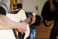 The young man is a soloist on an acoustic guitar