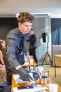 Young man sommelier pours wine at Be Wine Show, Kyiv, Ukraine Royalty Free Stock Photo