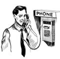 Young man speaking over payphone Royalty Free Stock Photo
