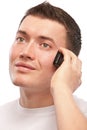 Young man speaks by mobile phone