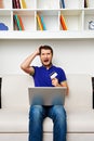 Young man spend all his money in internet Royalty Free Stock Photo