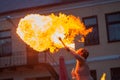 A young man spews a fire out of his mouth Royalty Free Stock Photo