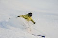 Young man having fun riding on the snowboard