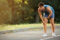 Young man in sportswear having knee problems Royalty Free Stock Photo