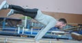 Gymnast performing planche at gym