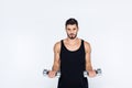 young man in sportswear working out with dumbbells Royalty Free Stock Photo