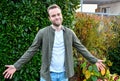 Young man , with spread empty hands sideways Royalty Free Stock Photo