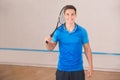 Young man squash player exercise game in the gym Royalty Free Stock Photo