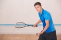 Young man squash player exercise game in the gym Royalty Free Stock Photo