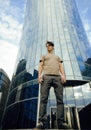Young man stand in front of modern business building Royalty Free Stock Photo