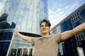 Young man stand in front of modern business building Royalty Free Stock Photo
