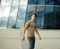 Young man stand in front of modern business building Royalty Free Stock Photo