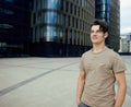 Young man stand in front of modern business building Royalty Free Stock Photo