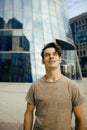 Young man stand in front of modern business building Royalty Free Stock Photo