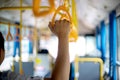 young man stand inside the bus yellow hand grip for the passenger to hold Royalty Free Stock Photo