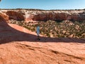 Young man standing in the Arches National Park in Arizona, USA.