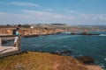 Young man standing on the edge of the pier by the Californian Royalty Free Stock Photo