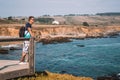 Young man standing on the edge of the pier by the Californian Royalty Free Stock Photo