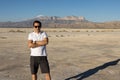 Young man standing in front of Guadalupe Peak, El Capitan