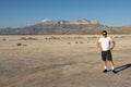 Young man standing in front of Guadalupe Peak, El Capitan